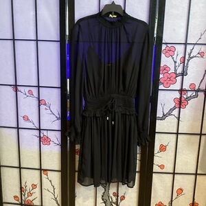 Sophisticated black dress sheer with slip/ shell underneath. Only worn once